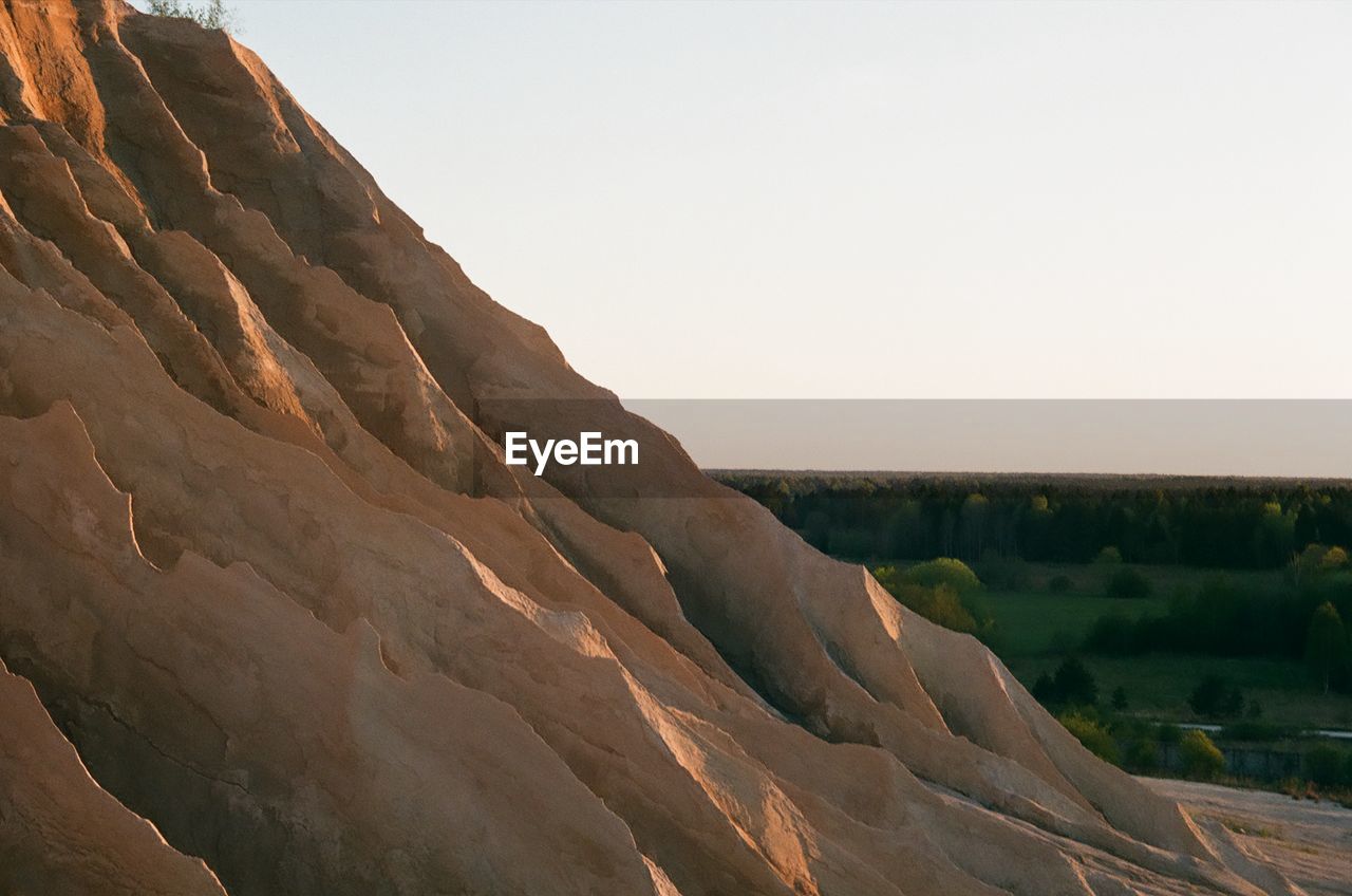 SCENIC VIEW OF MOUNTAINS AGAINST CLEAR SKY