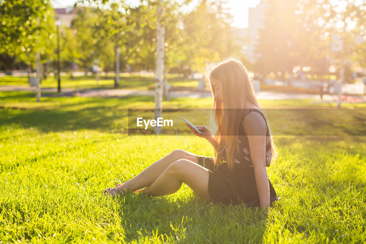 Woman sitting on field