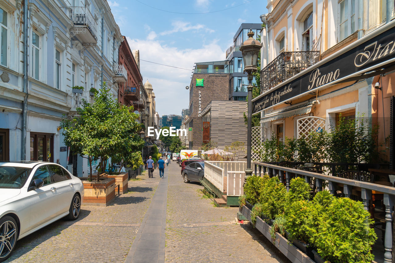 STREET AMIDST BUILDINGS IN CITY