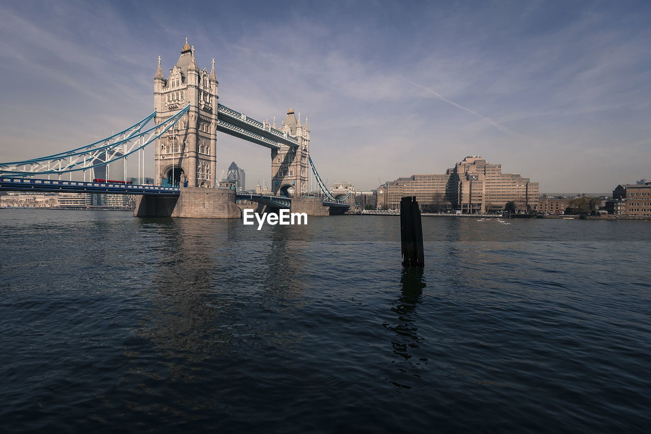 Tower bridge over thames river against sky