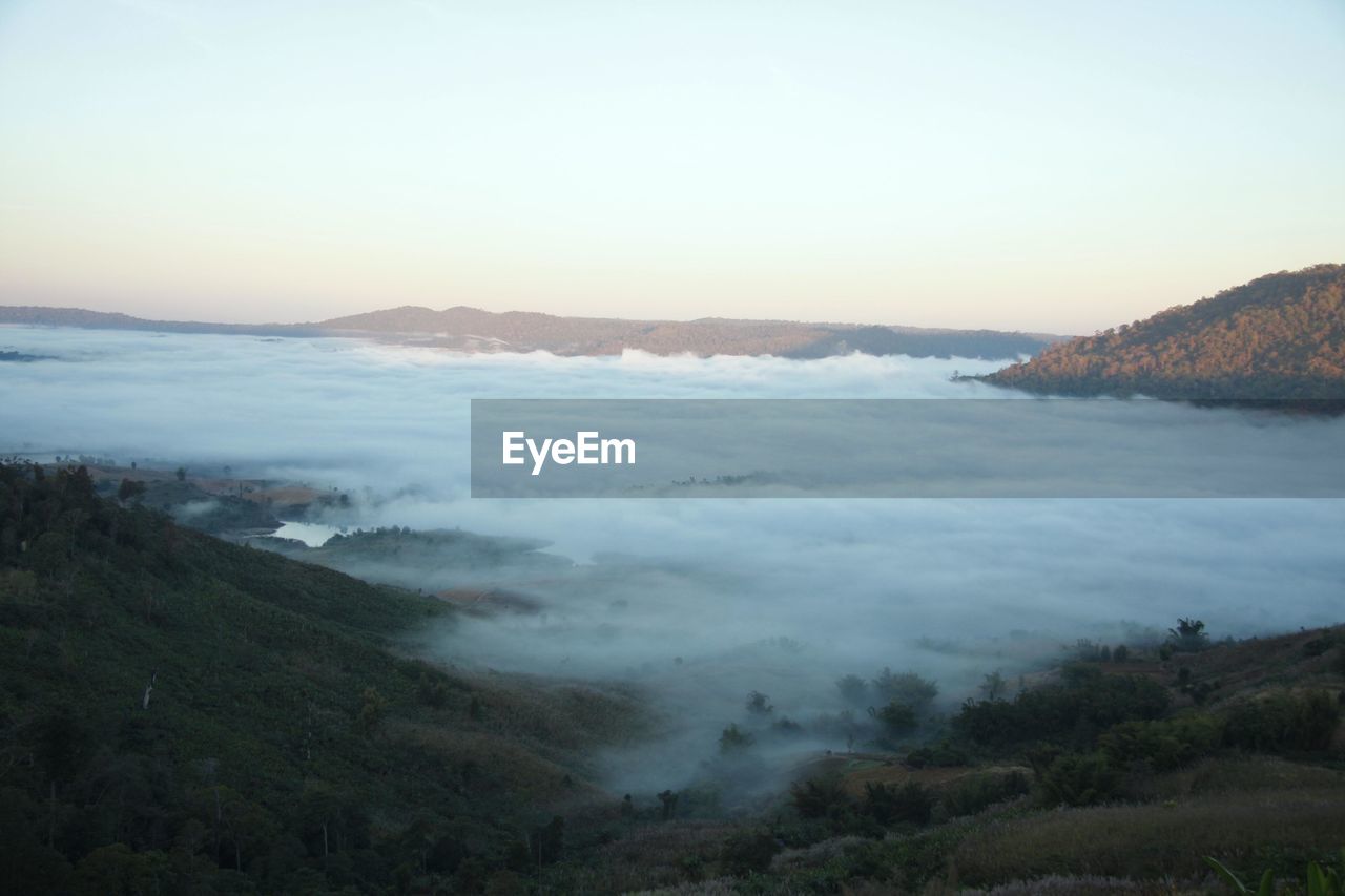 SCENIC VIEW OF LANDSCAPE AND MOUNTAINS AGAINST CLEAR SKY