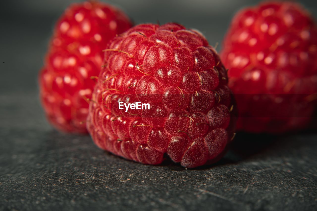 Close-up of red raspberries on table