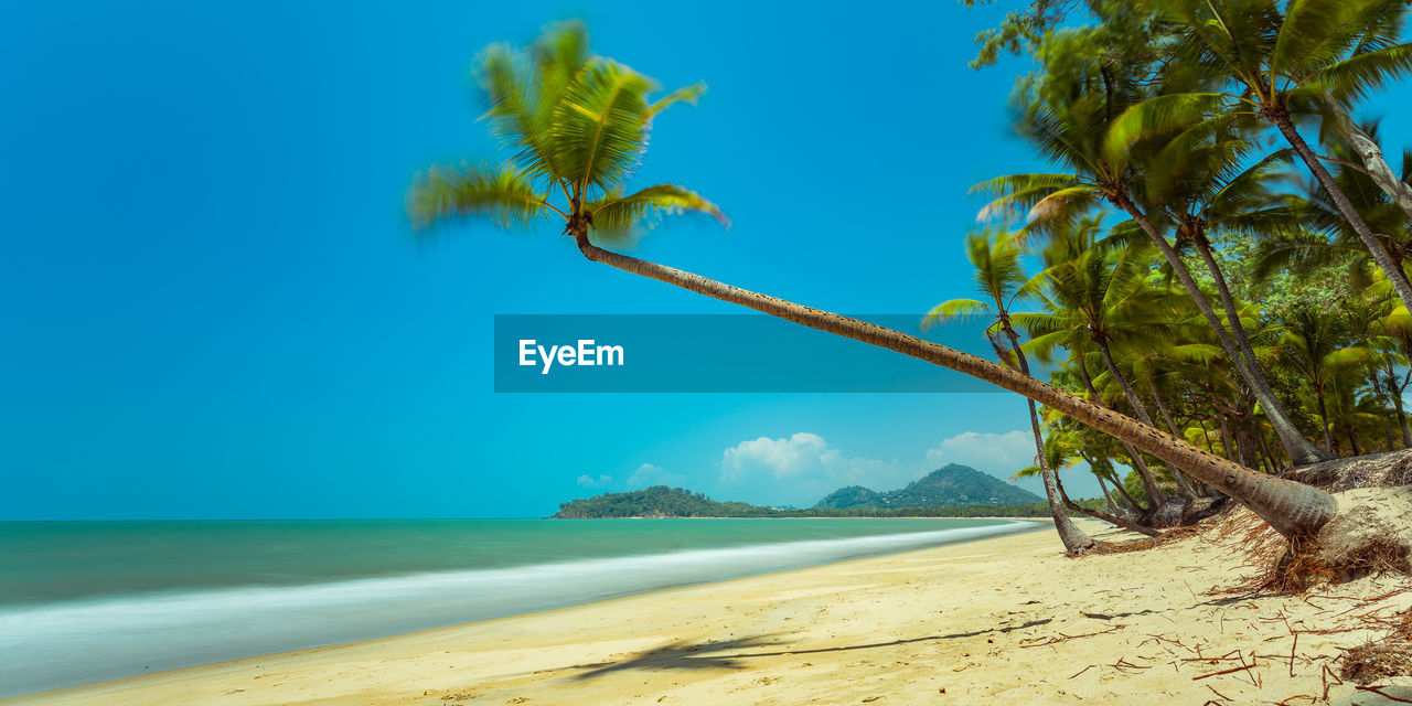 VIEW OF BEACH AGAINST BLUE SKY