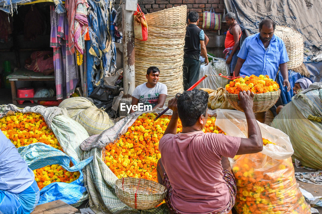 GROUP OF PEOPLE FOR SALE AT MARKET