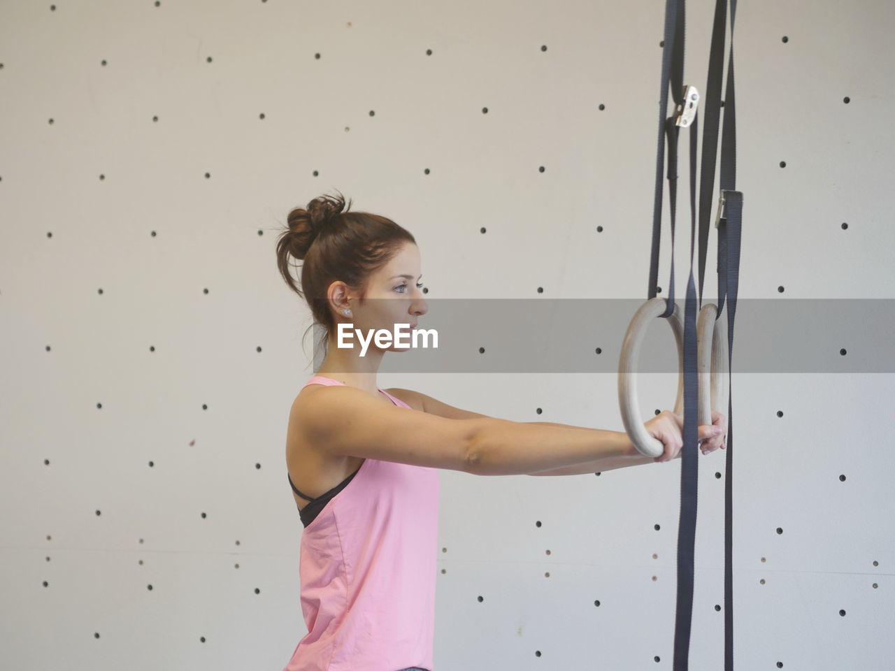 Confident woman exercising at gym