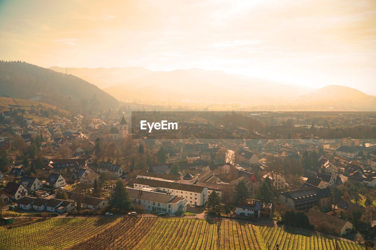 High angle view of townscape against sky during sunset