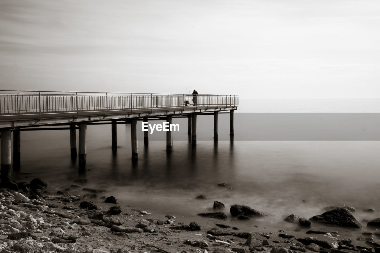 Pier on sea against sky