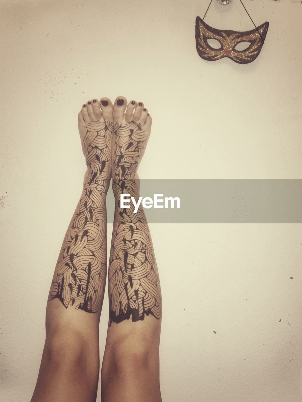 Low section of woman with henna tattoo