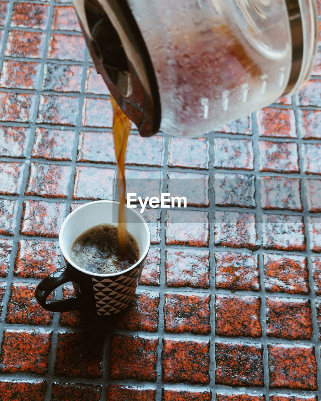 Close-up of drink pouring into cup