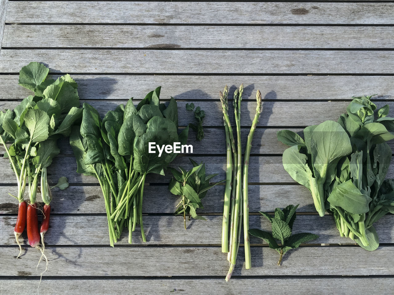 Directly above shot of vegetables on boardwalk