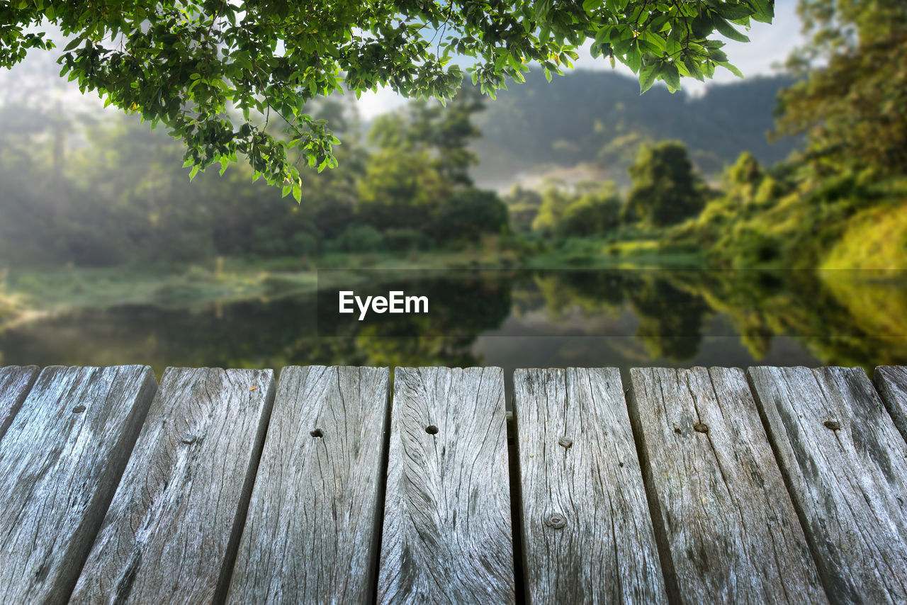 CLOSE-UP OF WOODEN FENCE ON PIER