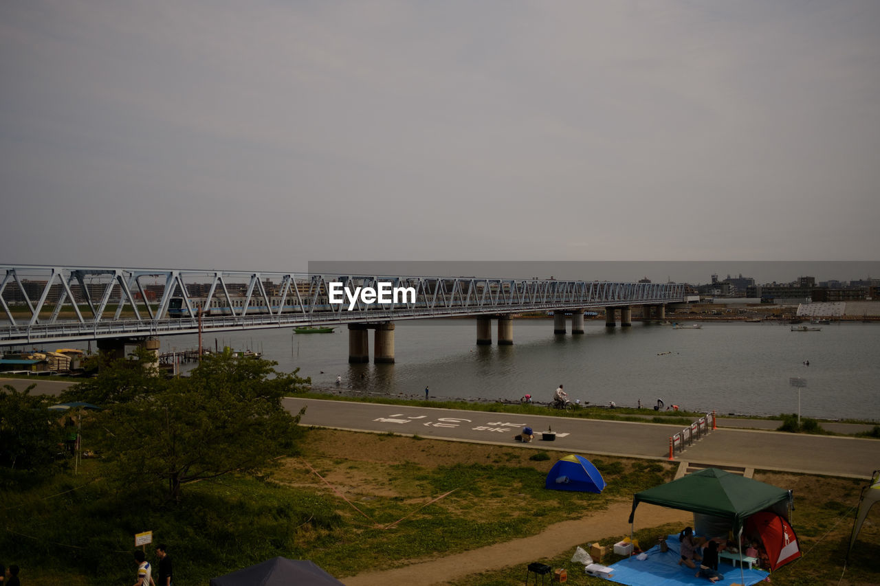 VIEW OF BRIDGE OVER RIVER AGAINST CLEAR SKY