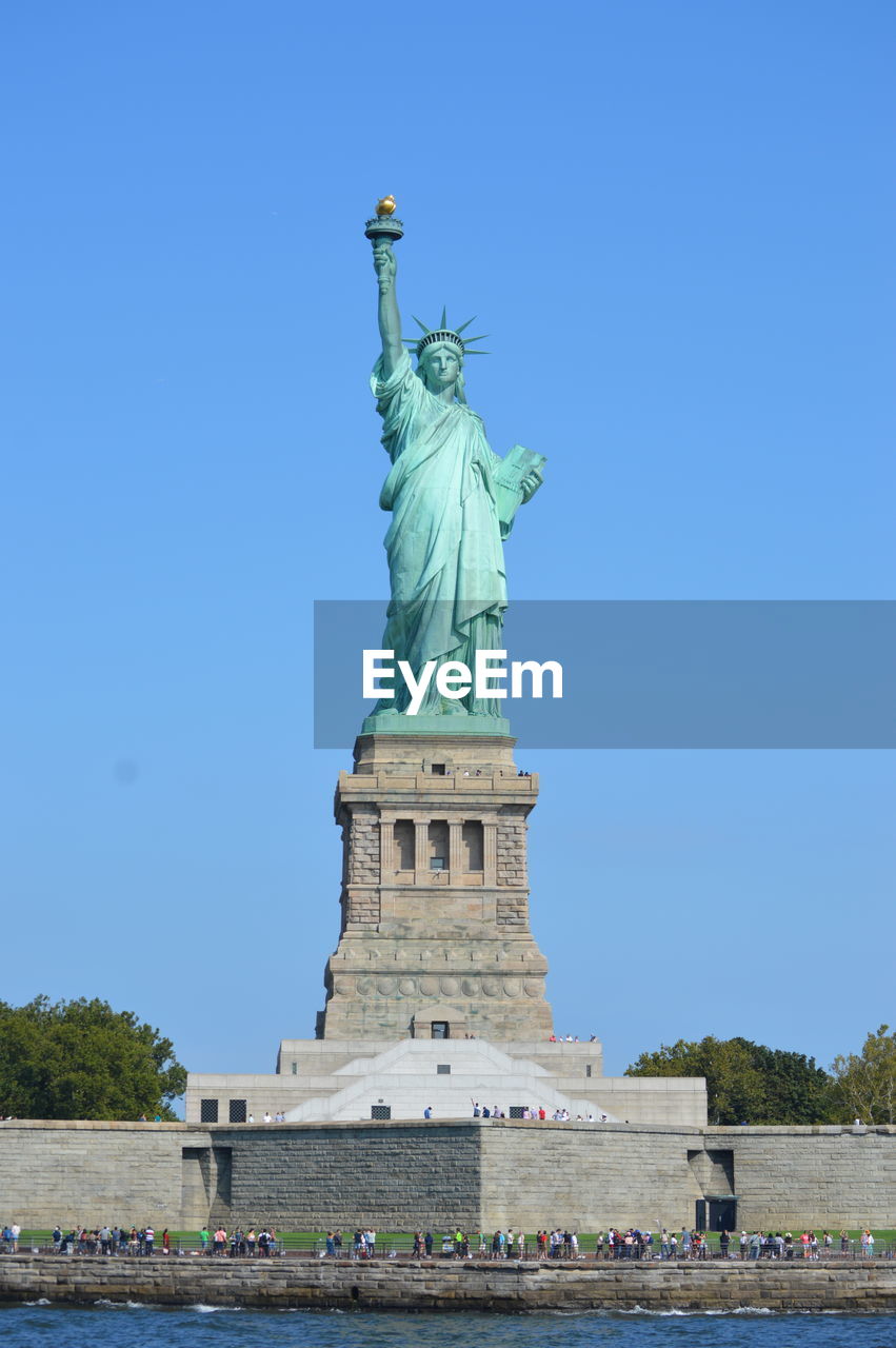 STATUE OF LIBERTY AGAINST CLEAR BLUE SKY