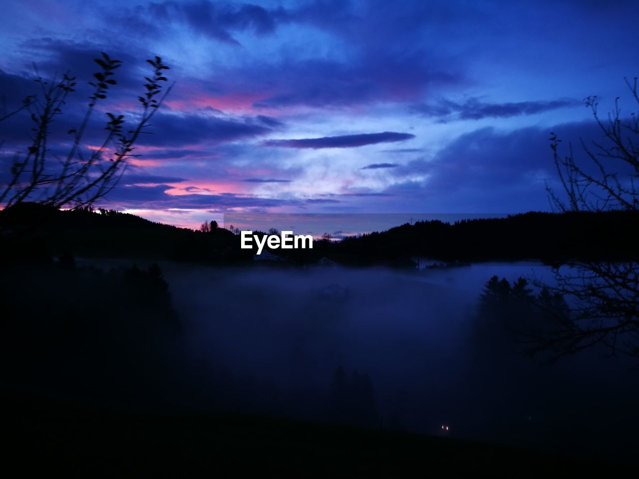 SILHOUETTE TREES ON LANDSCAPE AGAINST SKY AT SUNSET