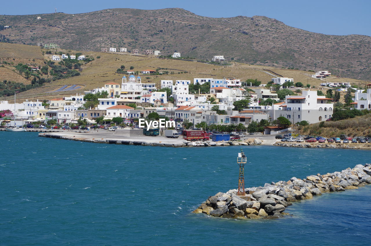 Scenic view of sea and buildings in town