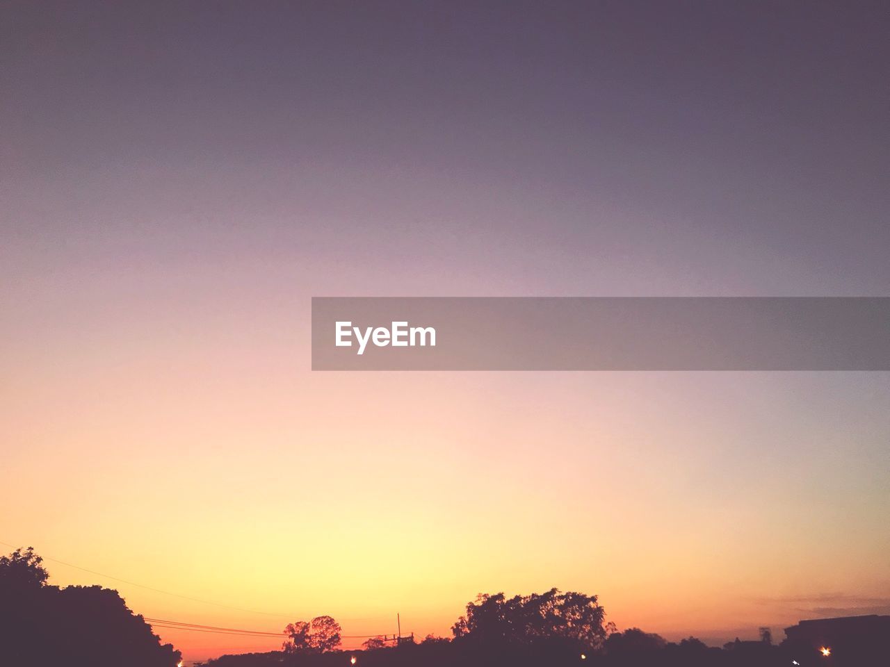 SCENIC VIEW OF SILHOUETTE TREES AGAINST SKY DURING SUNSET