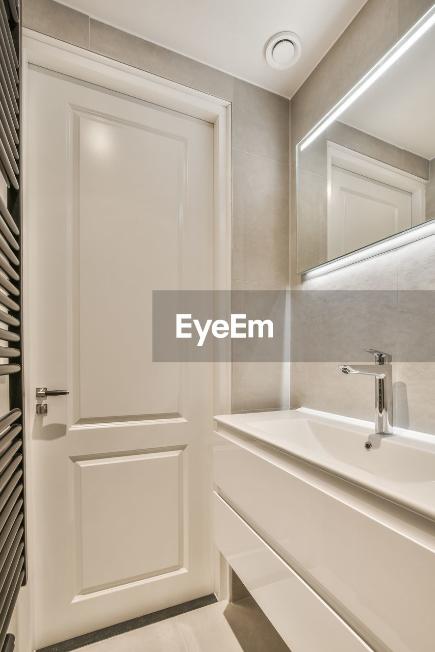 Low angle view of shower head in bathroom