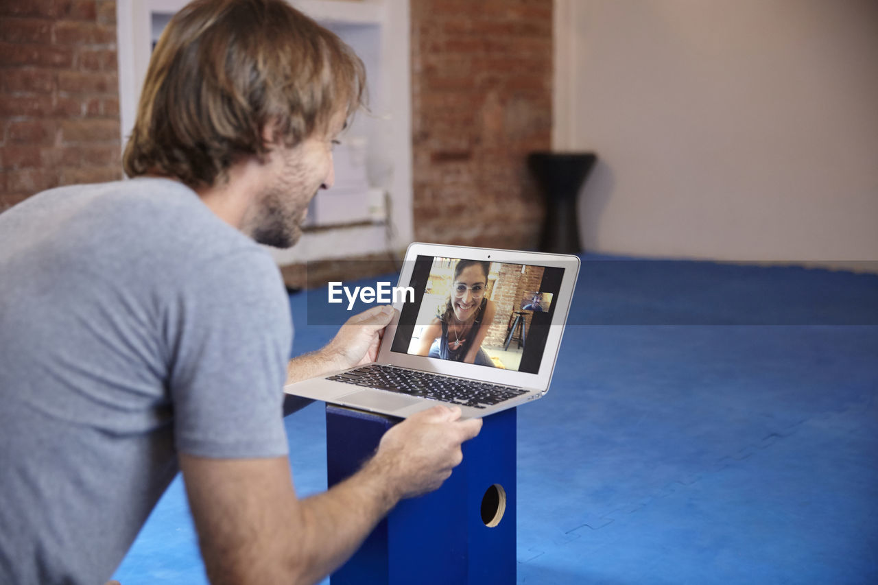 Man video conferencing at home