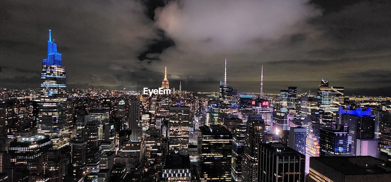 architecture, city, building exterior, built structure, cityscape, night, building, skyscraper, sky, landscape, skyline, illuminated, office building exterior, metropolis, urban skyline, travel destinations, nature, urban area, cloud, no people, evening, city life, tower, outdoors, metropolitan area, business finance and industry, residential district, environment, travel