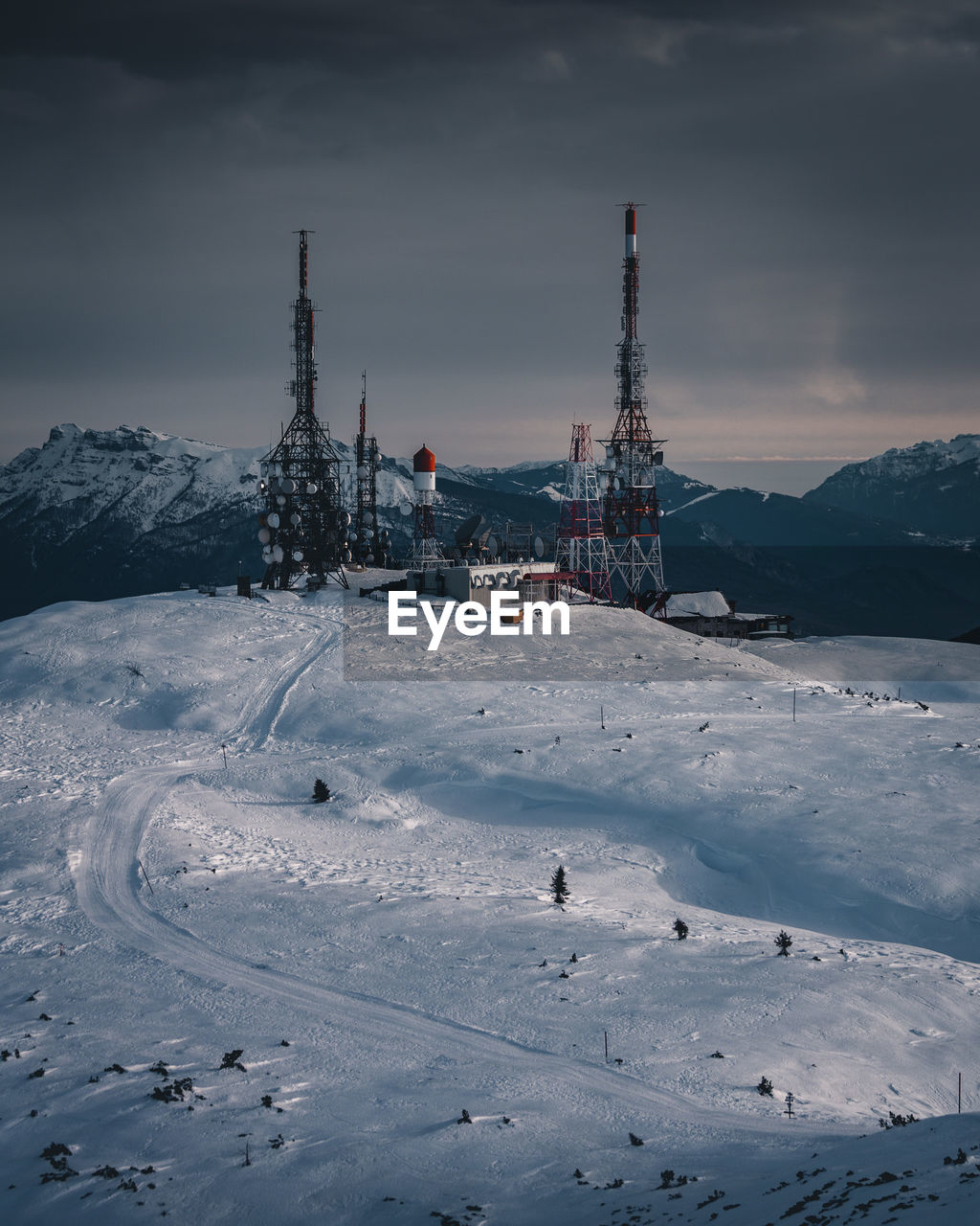 High angle view of snow covered ski resort against sky