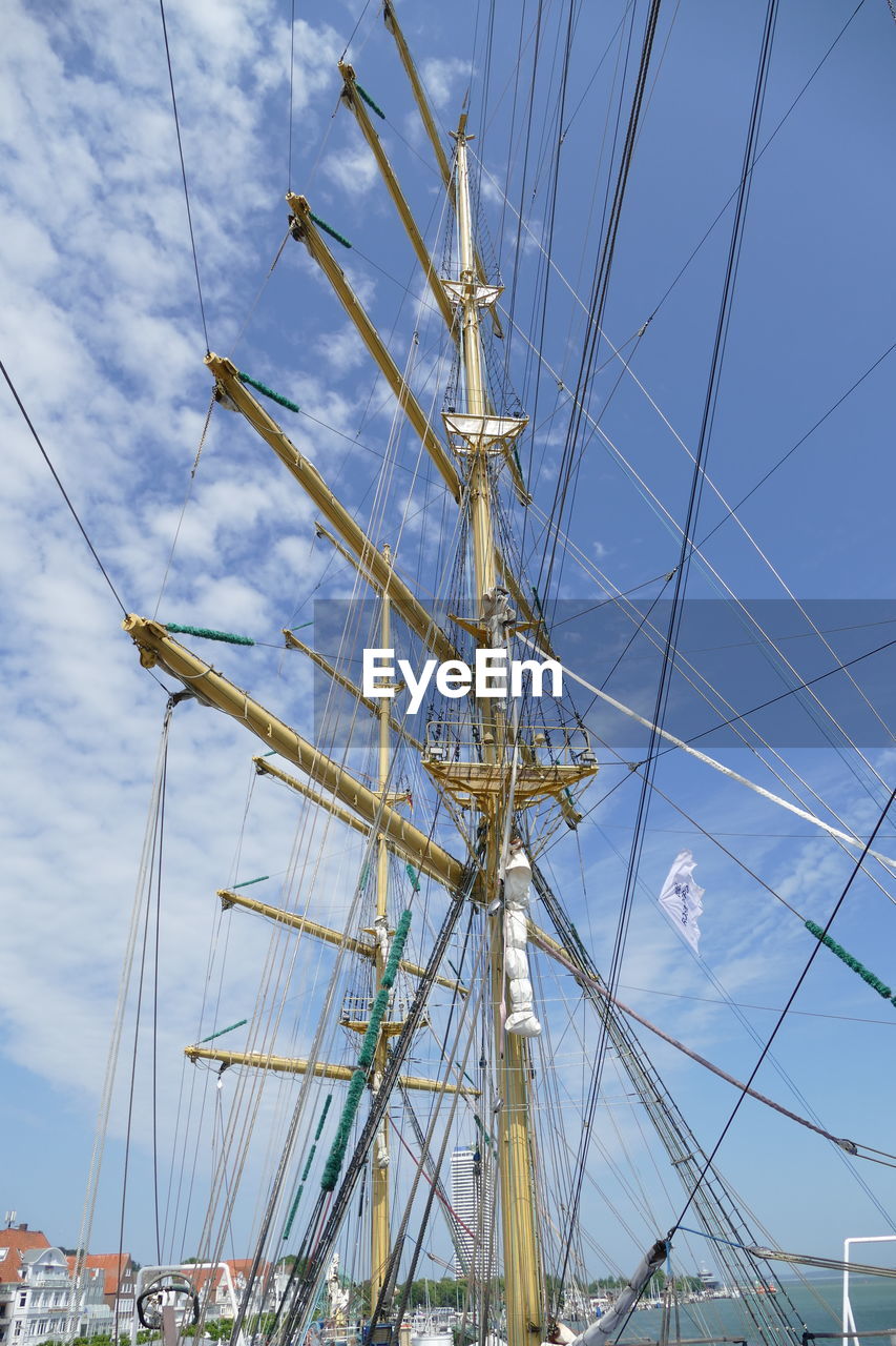 Low angle view of mast against sky