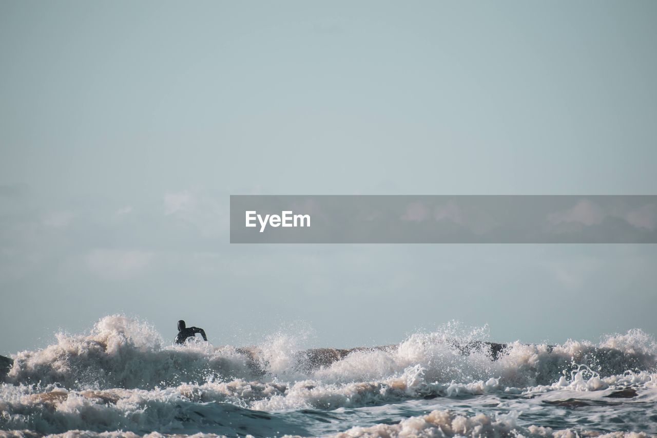 Surfer on sea