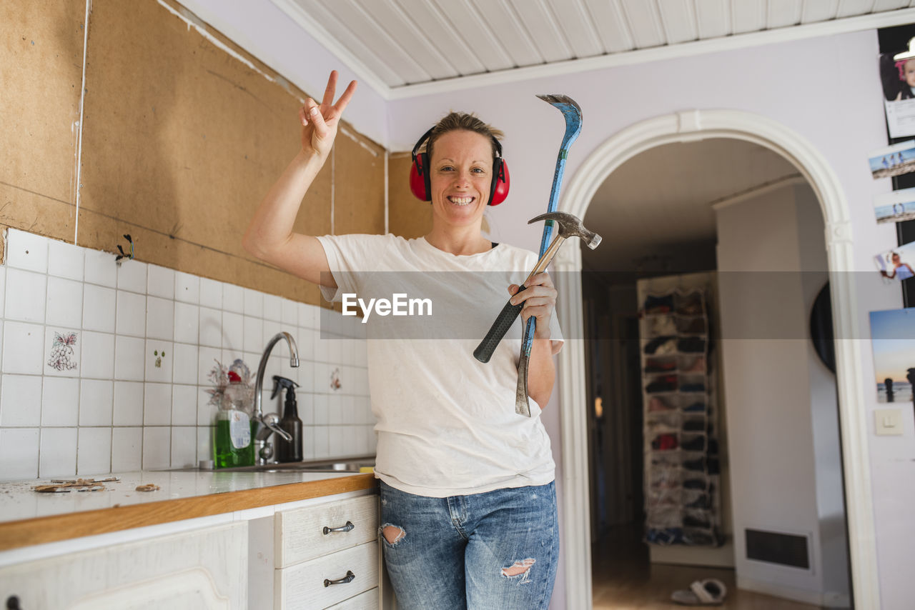 Woman renovating kitchen