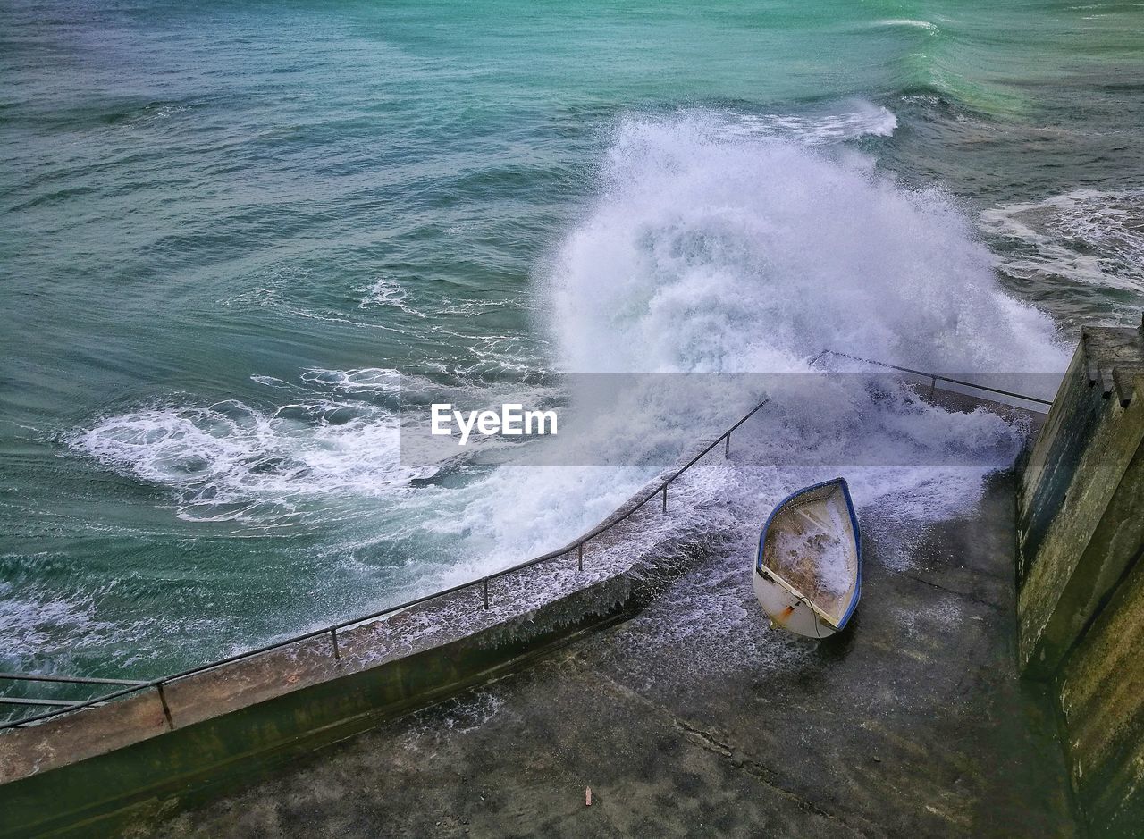 High angle view of waves splashing on promenade