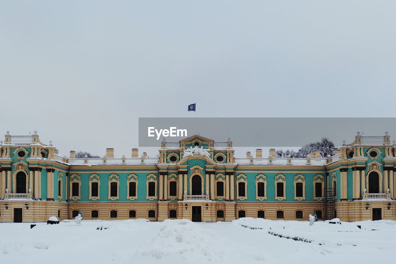 Buildings against sky during winter