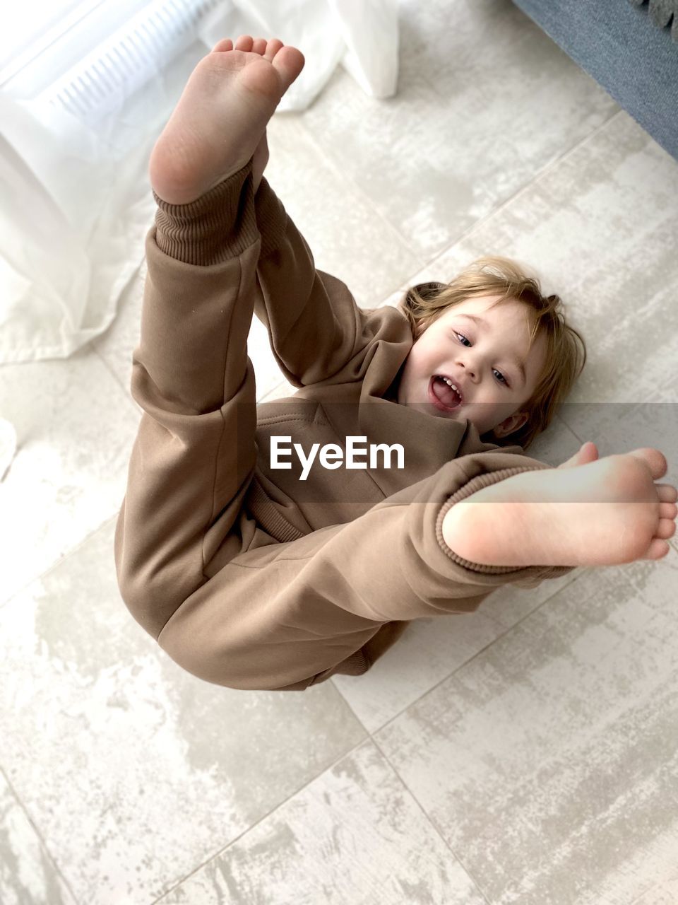 High angle view of girl lying on bed at home