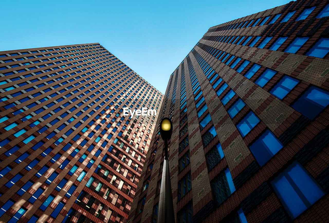 Low angle view of modern building against clear sky