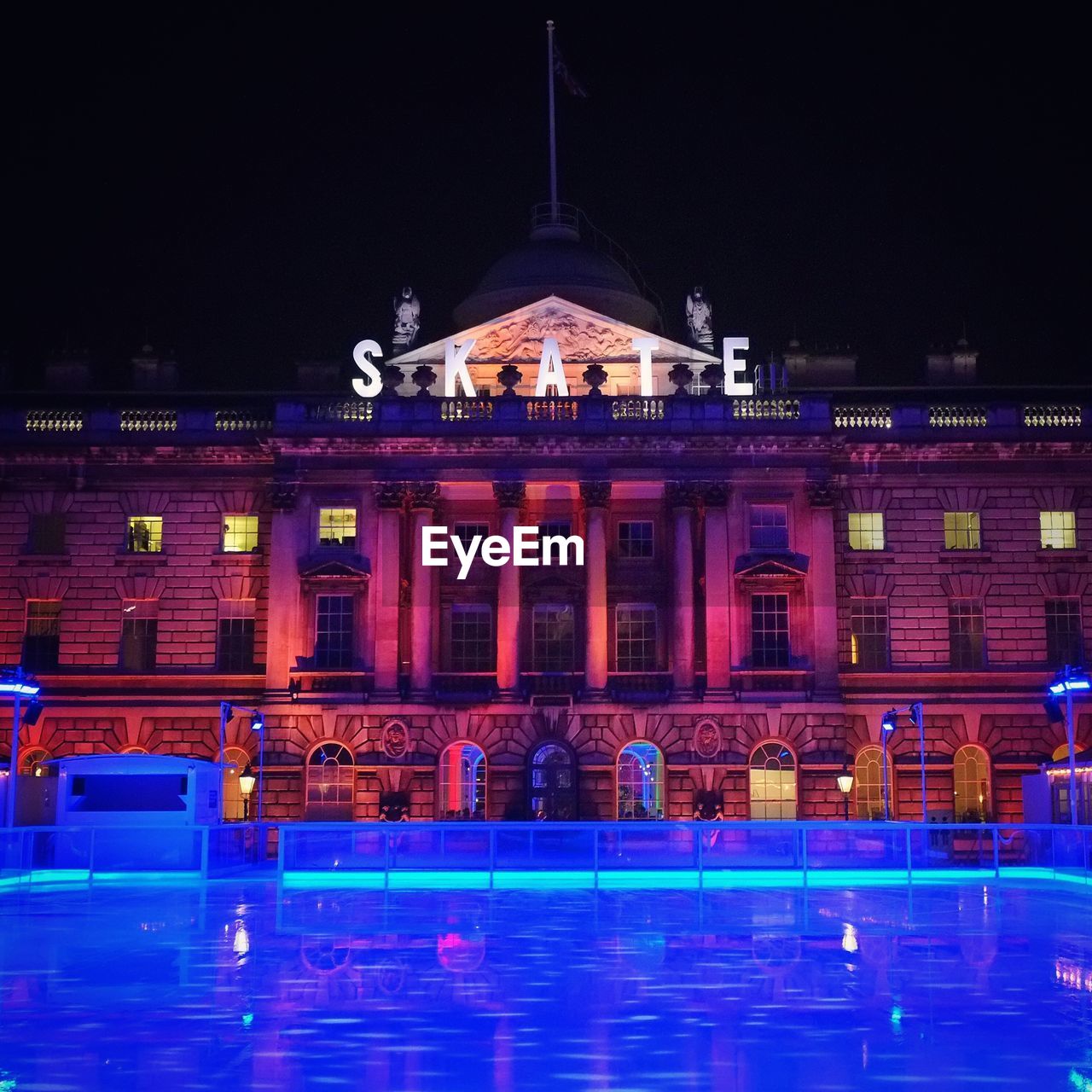 Ice rink at somerset house in city during night