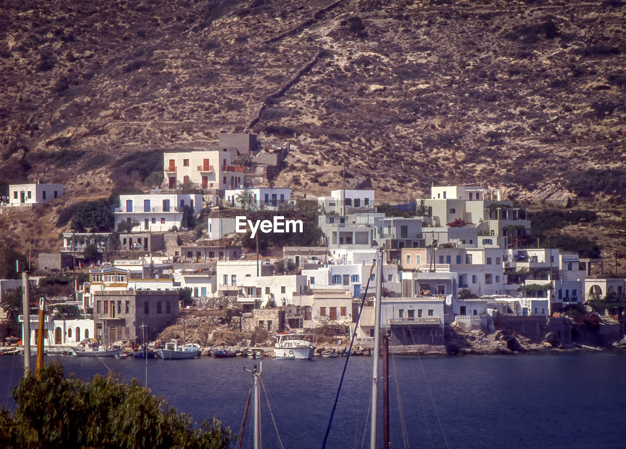 High angle view of buildings by sea