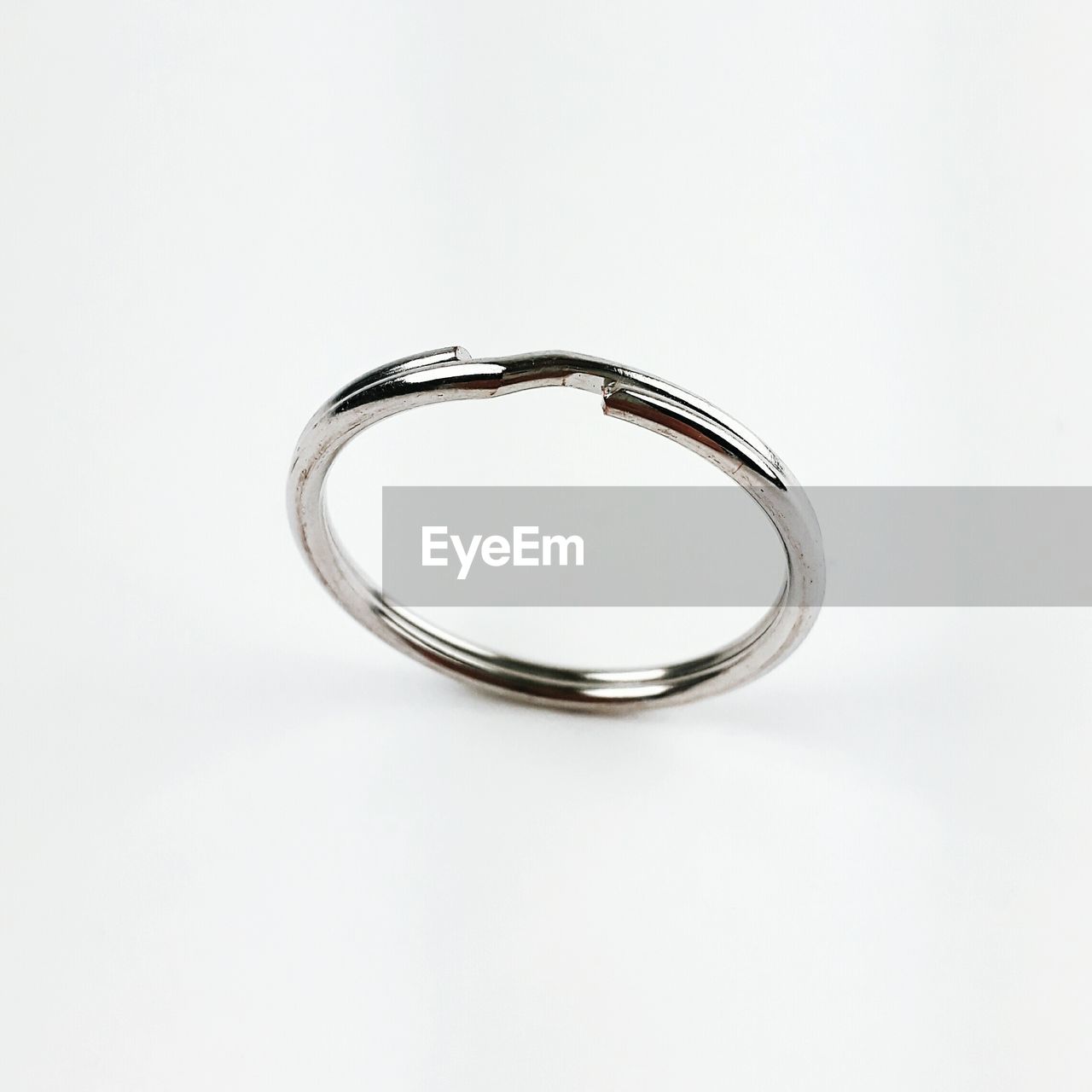 Close-up of ring over white background