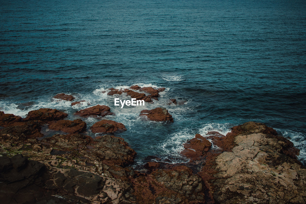 High angle view of rocks on beach