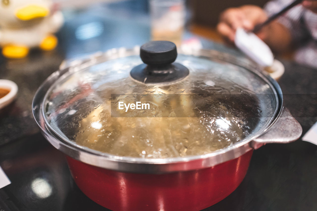 Boiling soup in sukiyaki pot.