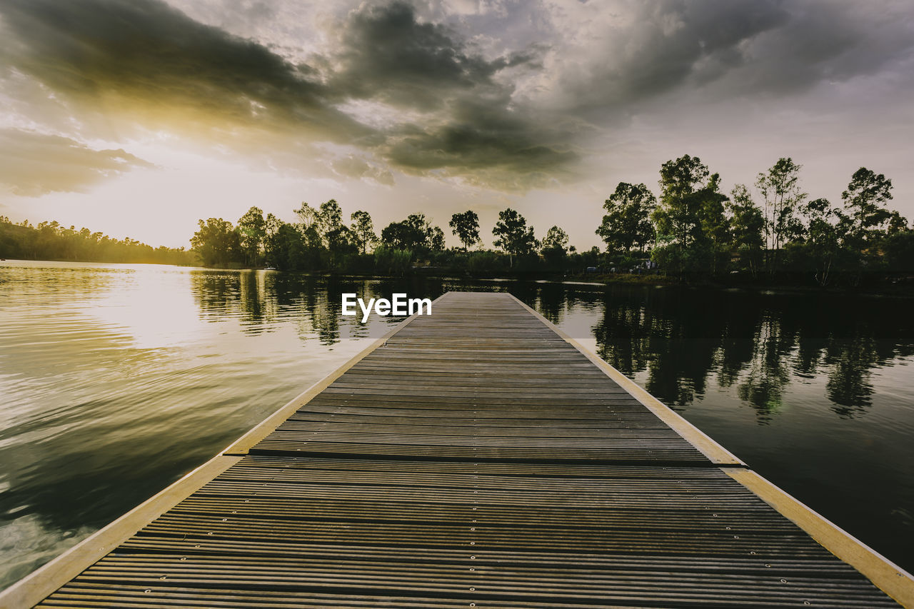 Scenic view of pier over lake against sky