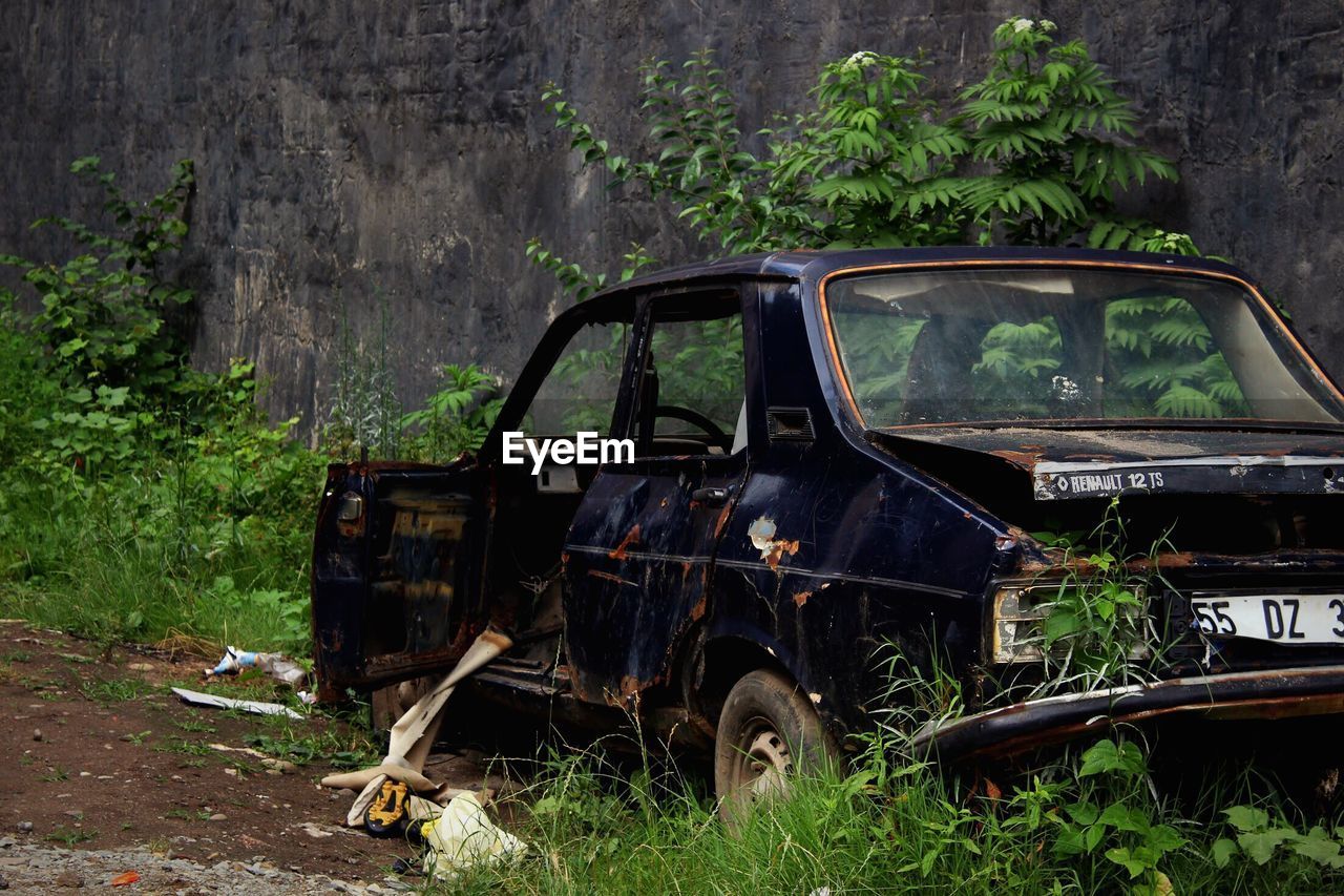 DAMAGED CAR ON FIELD