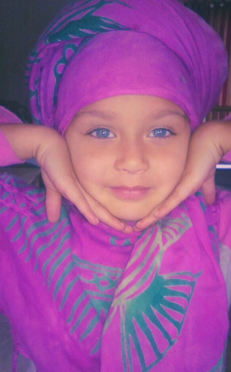 CLOSE-UP PORTRAIT OF CUTE GIRL WITH PINK PETALS