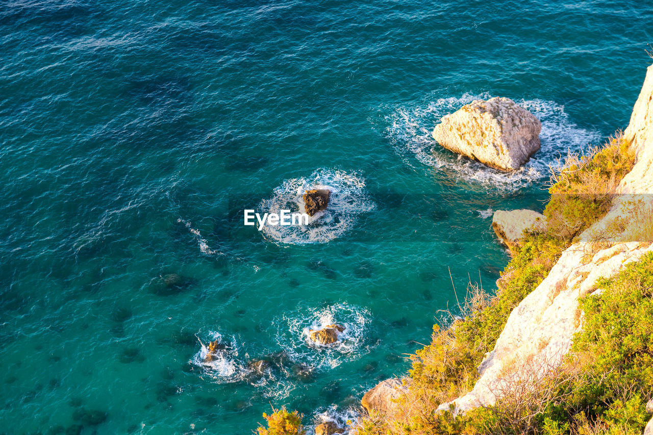 High angle view of rock formation in sea