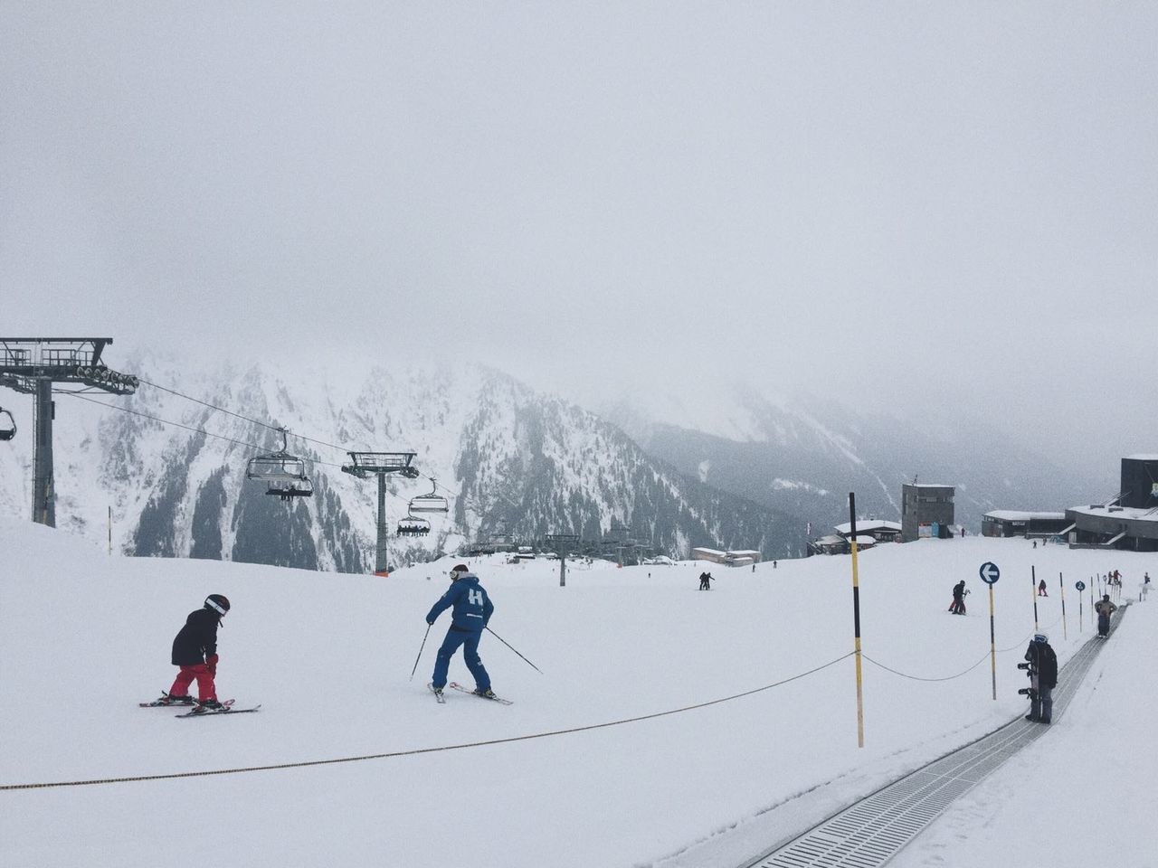 People skiing on snowy area