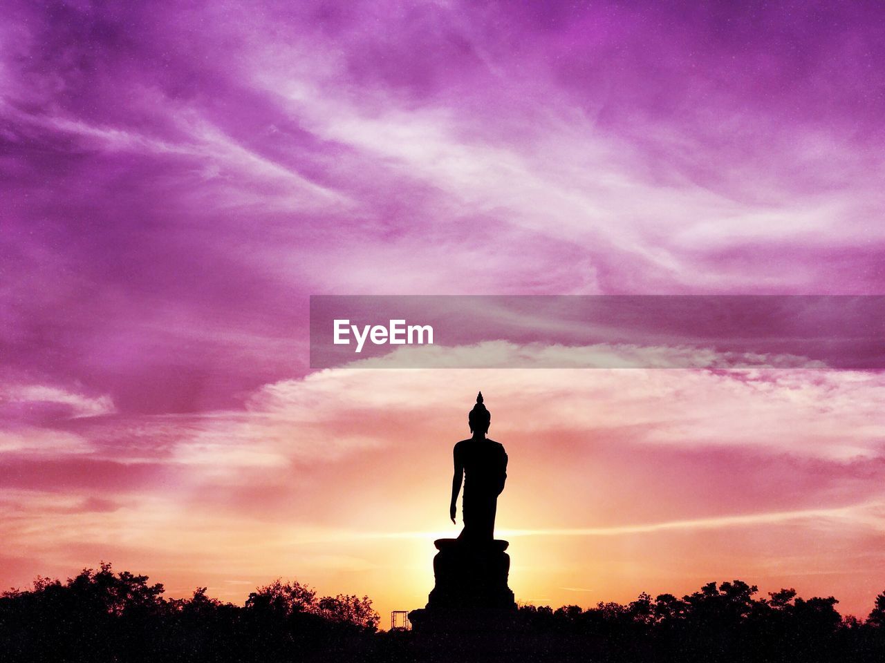 STATUE AGAINST SKY DURING SUNSET