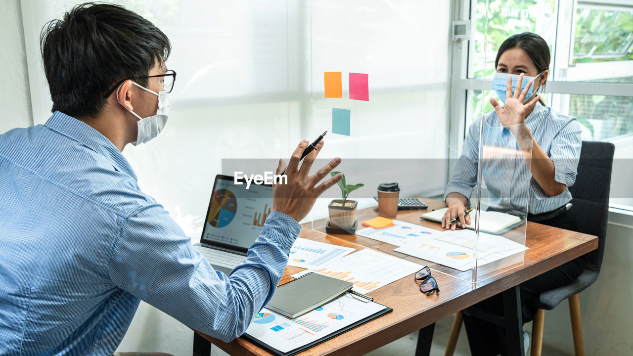 Business colleagues discussing at office