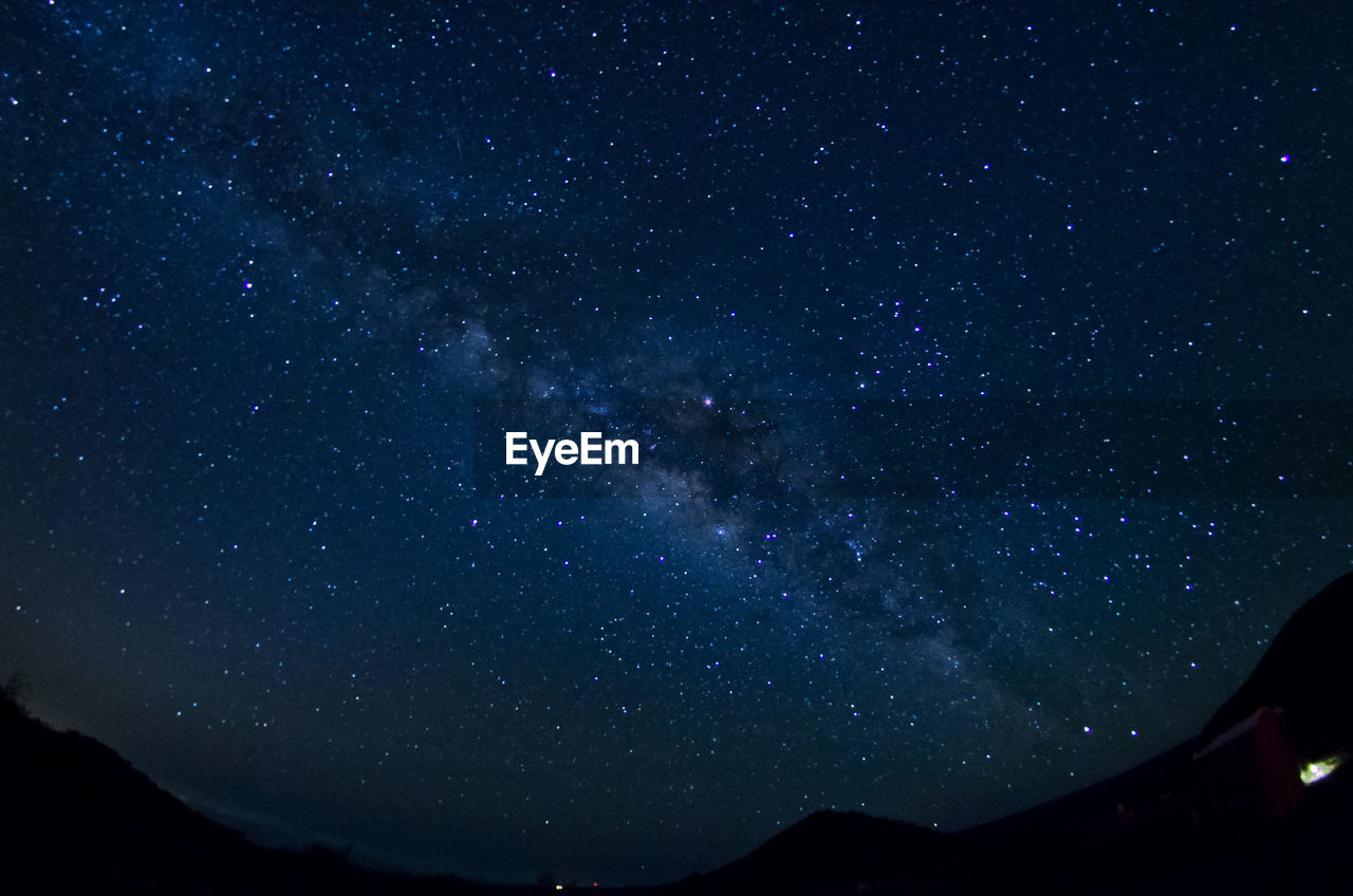 Low angle view of stars in sky at night