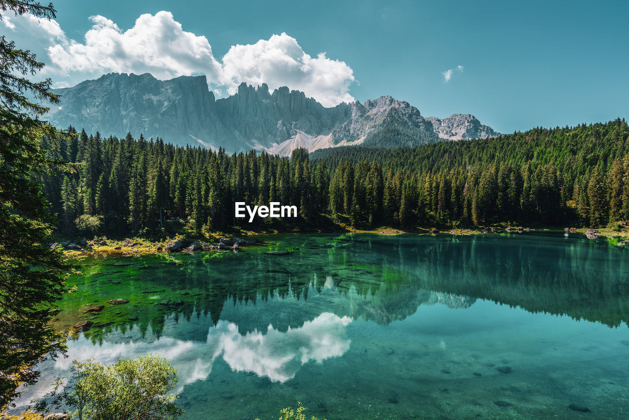 Lake carezza, view on the lake with the latemar range in the background. italy.