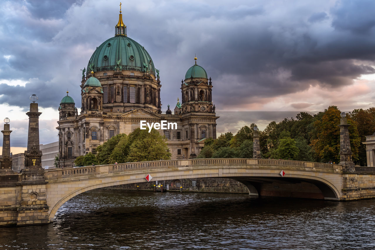 built structure, architecture, cloud - sky, water, building exterior, sky, bridge, dome, travel destinations, connection, travel, river, tourism, bridge - man made structure, nature, religion, waterfront, place of worship, no people, outdoors, arch bridge