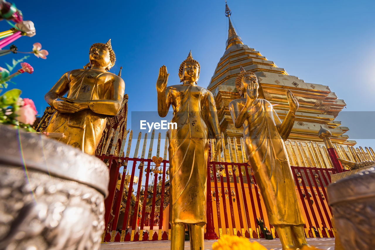 LOW ANGLE VIEW OF TEMPLE AGAINST BUILDING