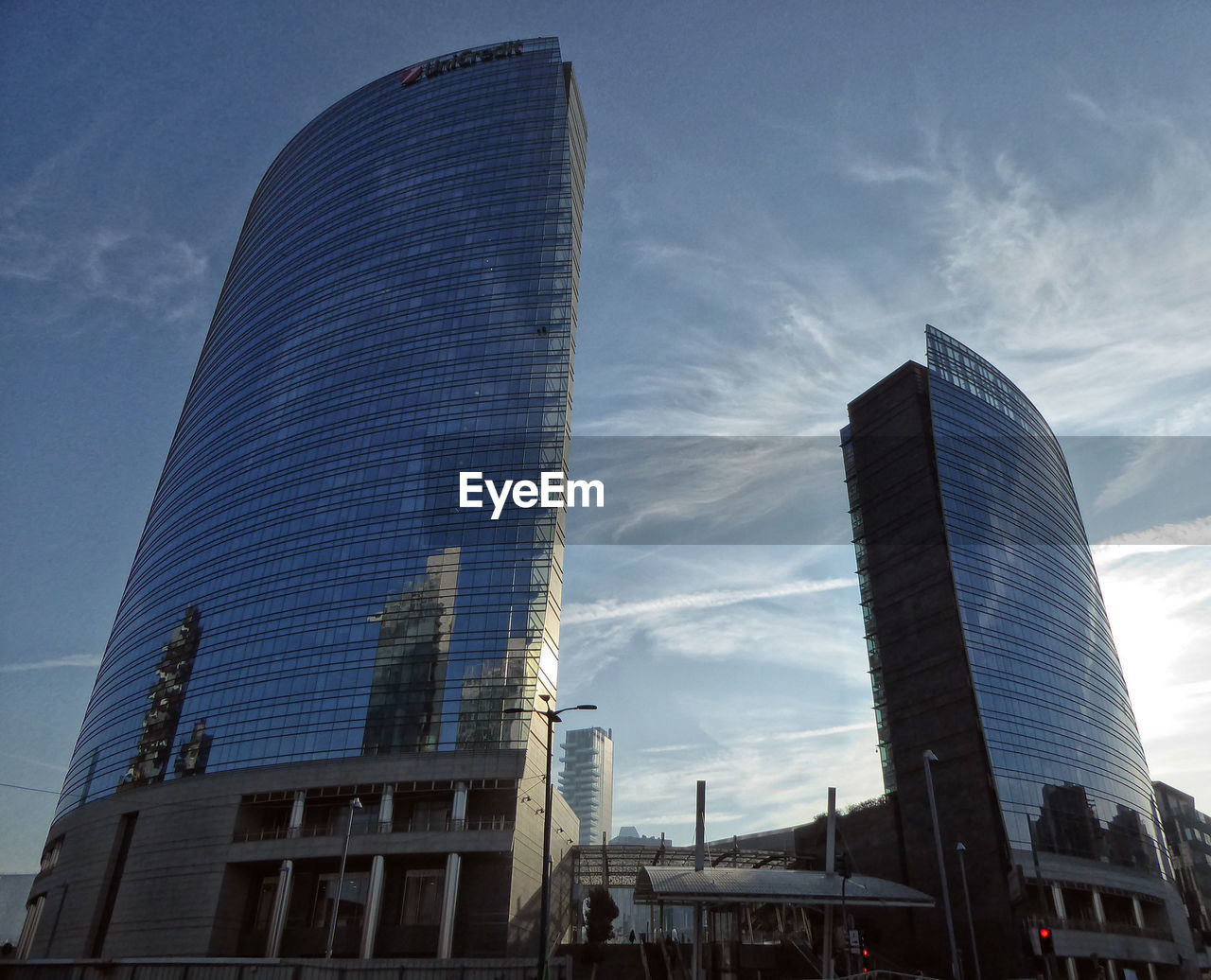 LOW ANGLE VIEW OF MODERN BUILDINGS IN CITY