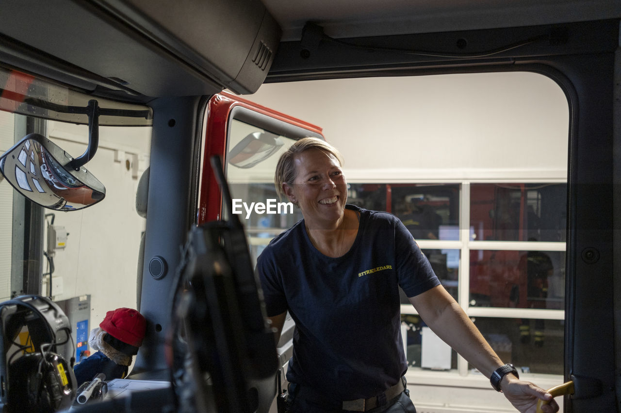 Smiling female firefighter