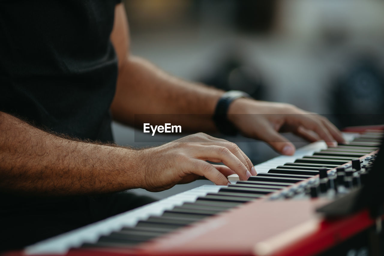 Close up man playing piano